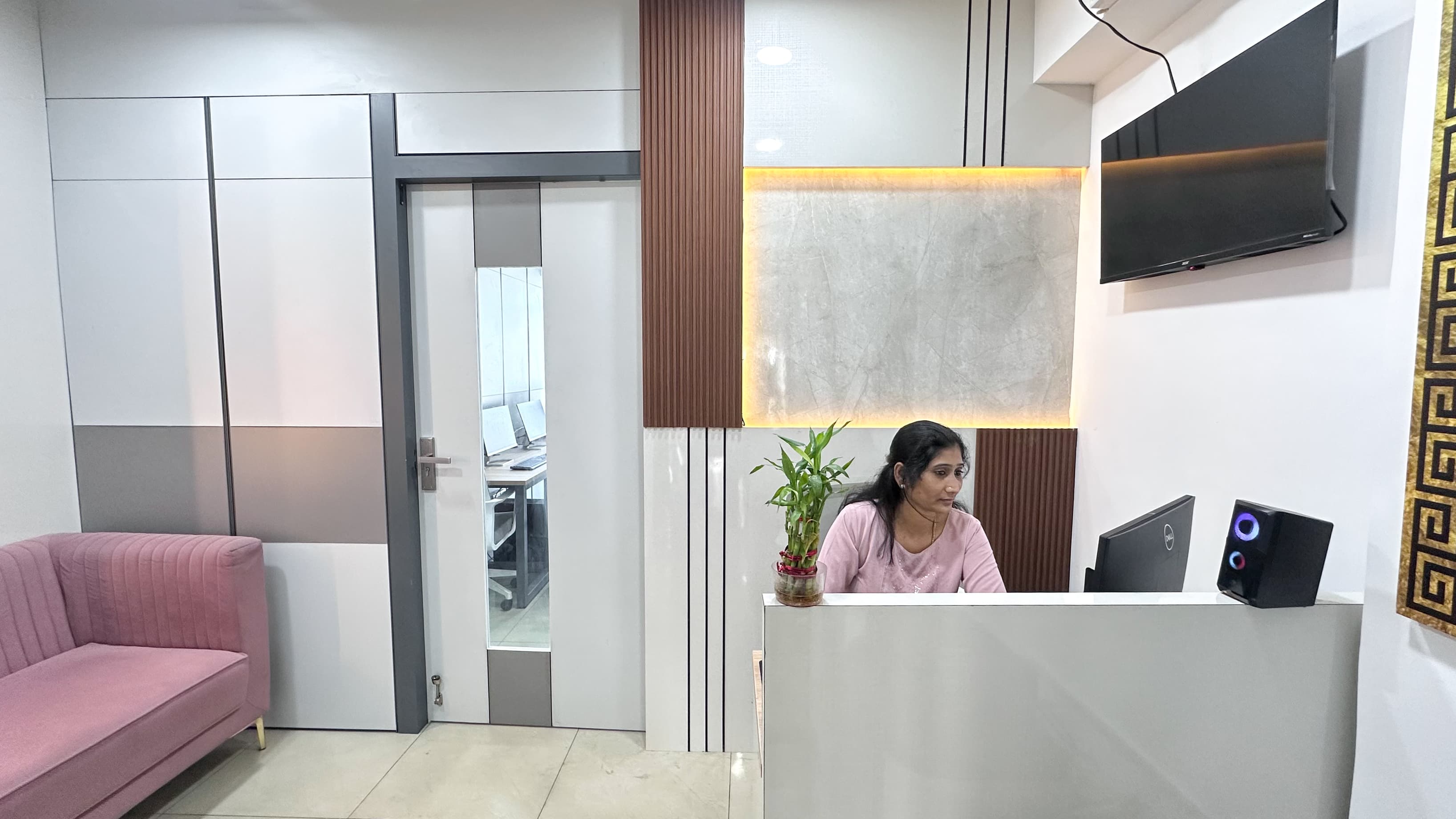 A modern and welcoming reception area with a clean design, comfortable seating, and a professional front desk that creates a 