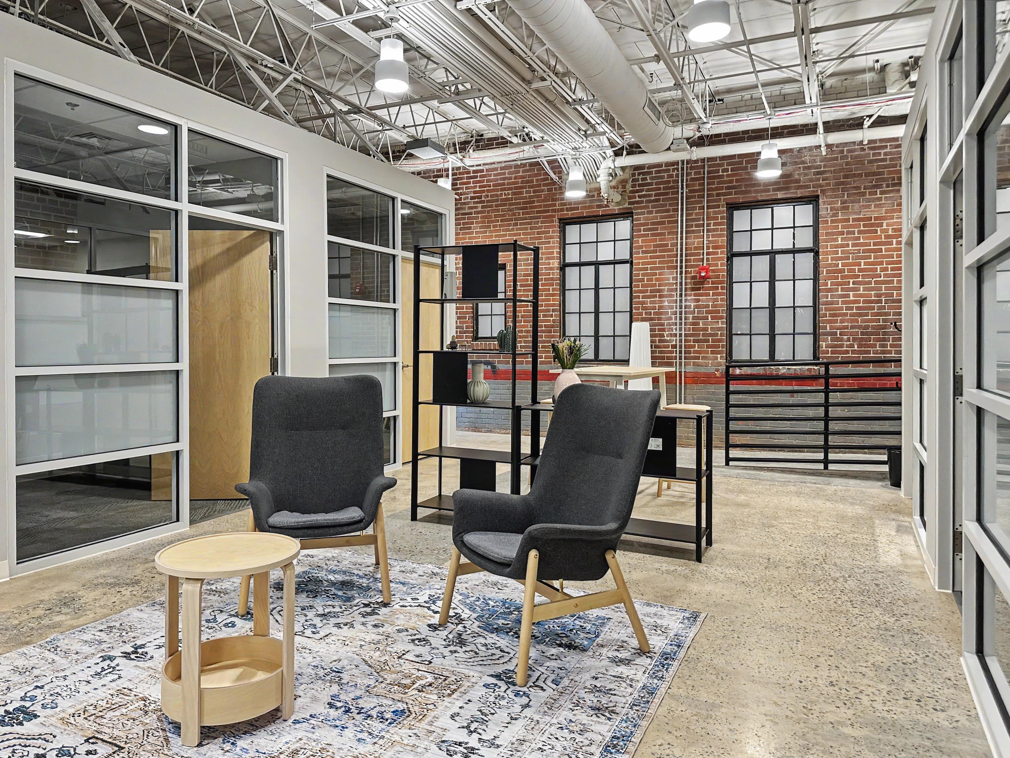Cozy lounge area with seating and tables. Cozy lounge area with seating and tables.