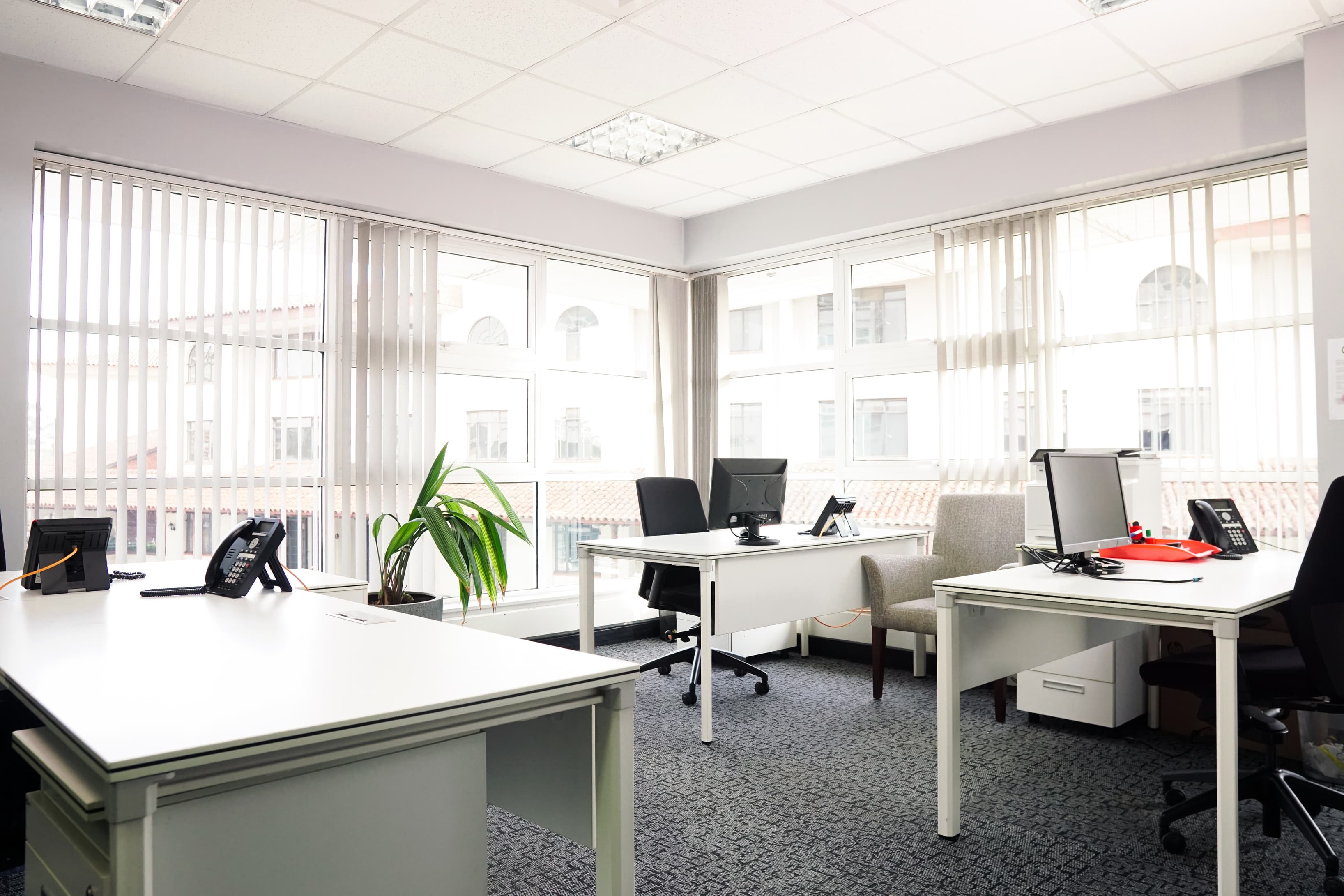 Modern workstations, ac ventilated offices, natural light from big windows. 