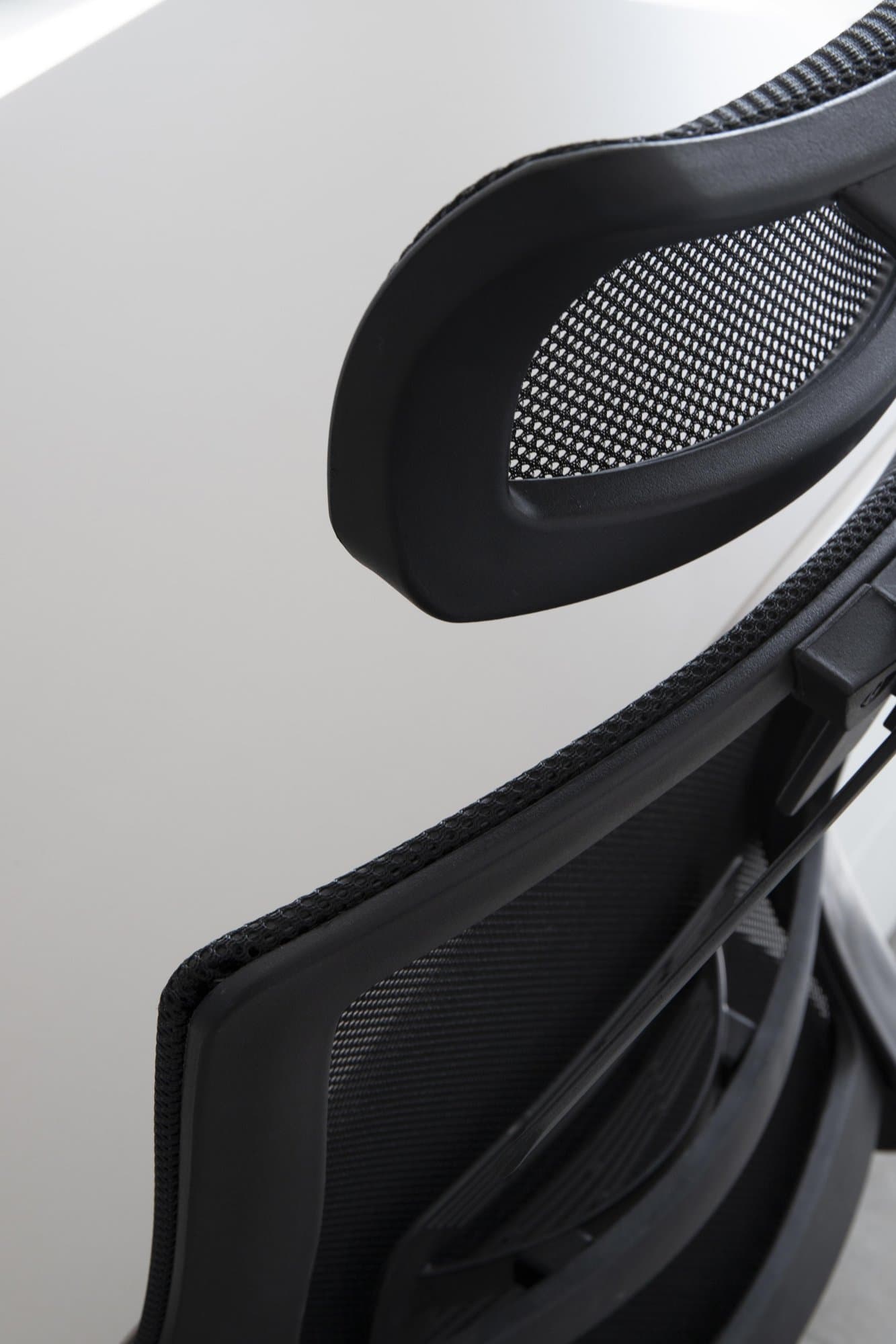 Detail of an ergonomic mesh chair. Detail of an ergonomic mesh chair.