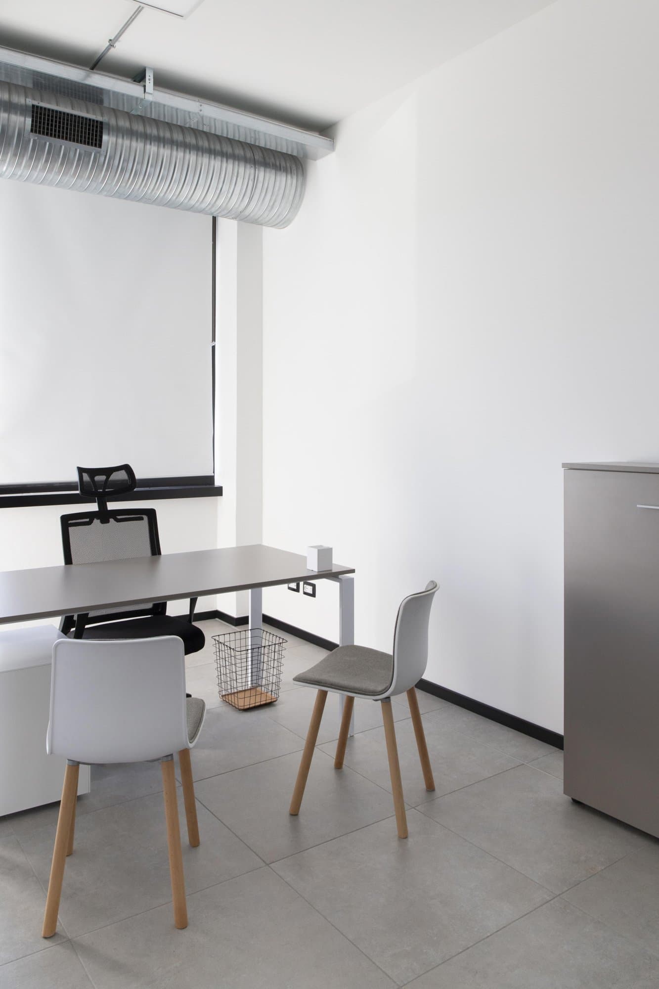 Private office with desk and chairs. Private office with desk and chairs.
