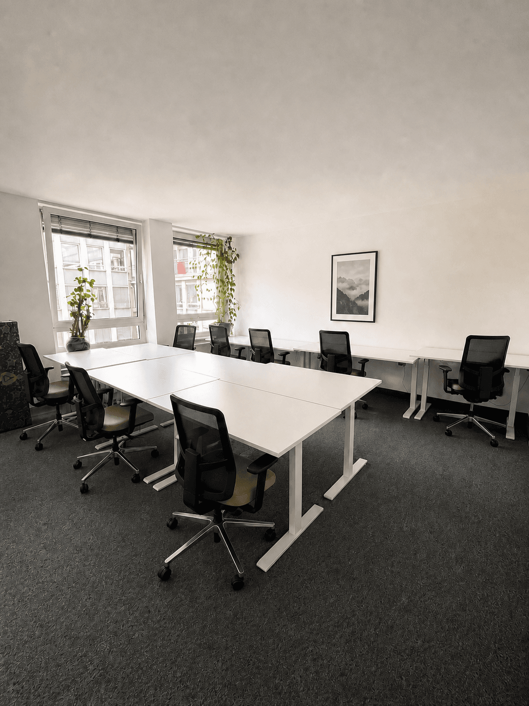 Airy open office filled with natural light, with ergonomic desks for comfortable workdays.