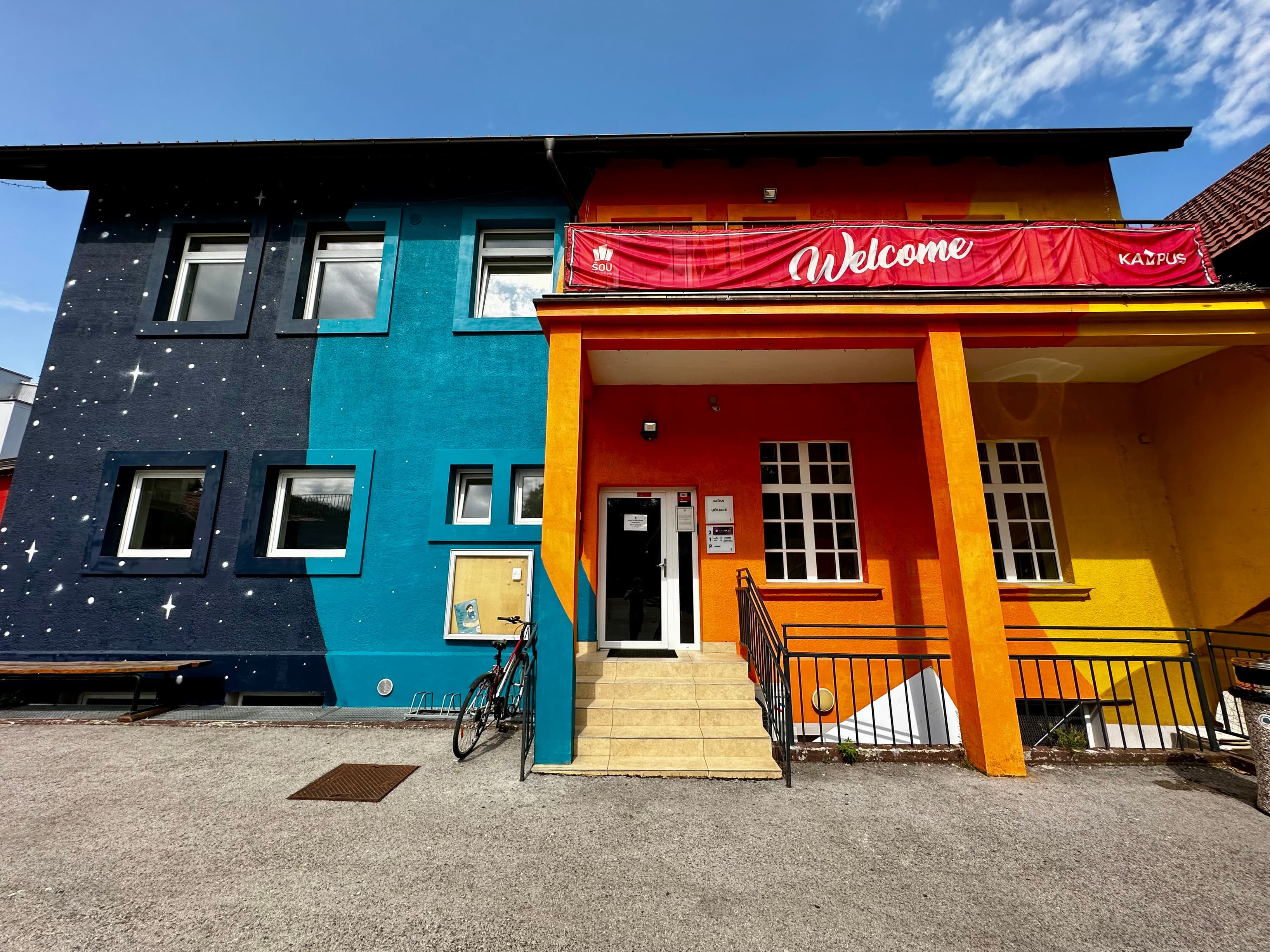 Building entrance with visible coworking balcony. Building entrance with visible coworking balcony.