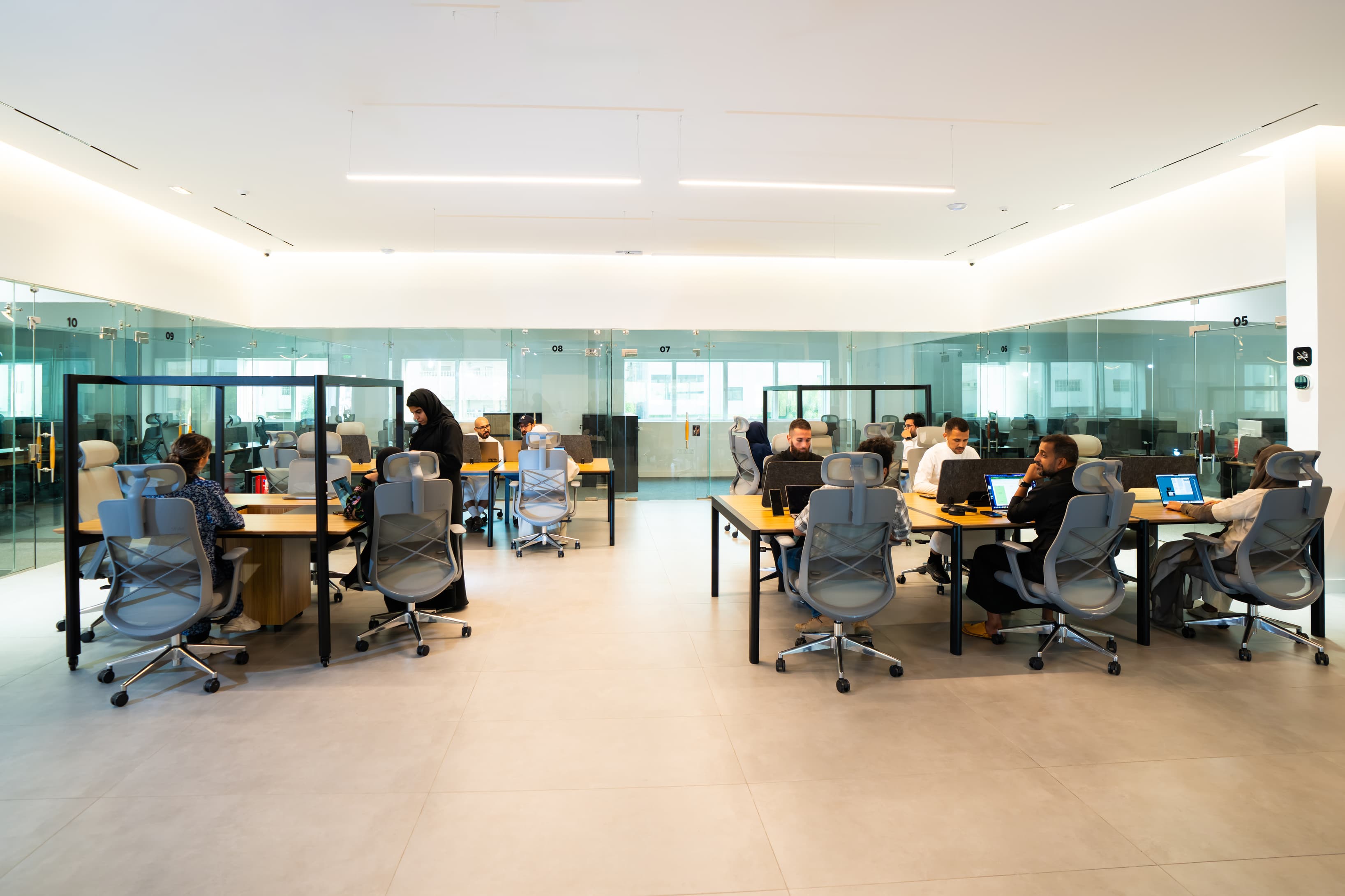 Meeting Room or Conference Area: An image of a well-equipped meeting space, showing a group working together, perhaps with a Meeting Room or Conference Area: An image of a well-equipped meeting space, showing a group working together, perhaps with a