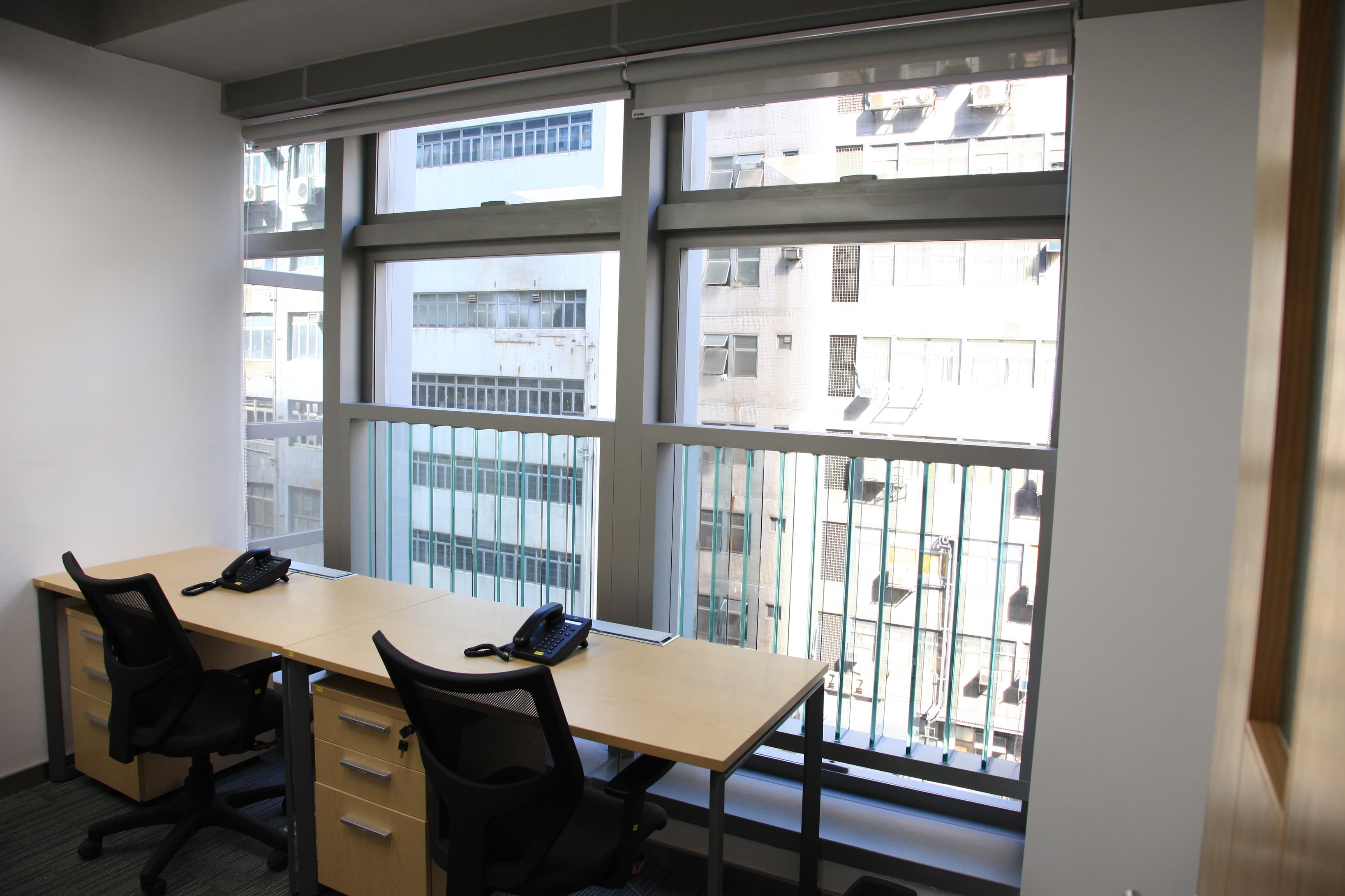 Office with city views and a wooden door 1