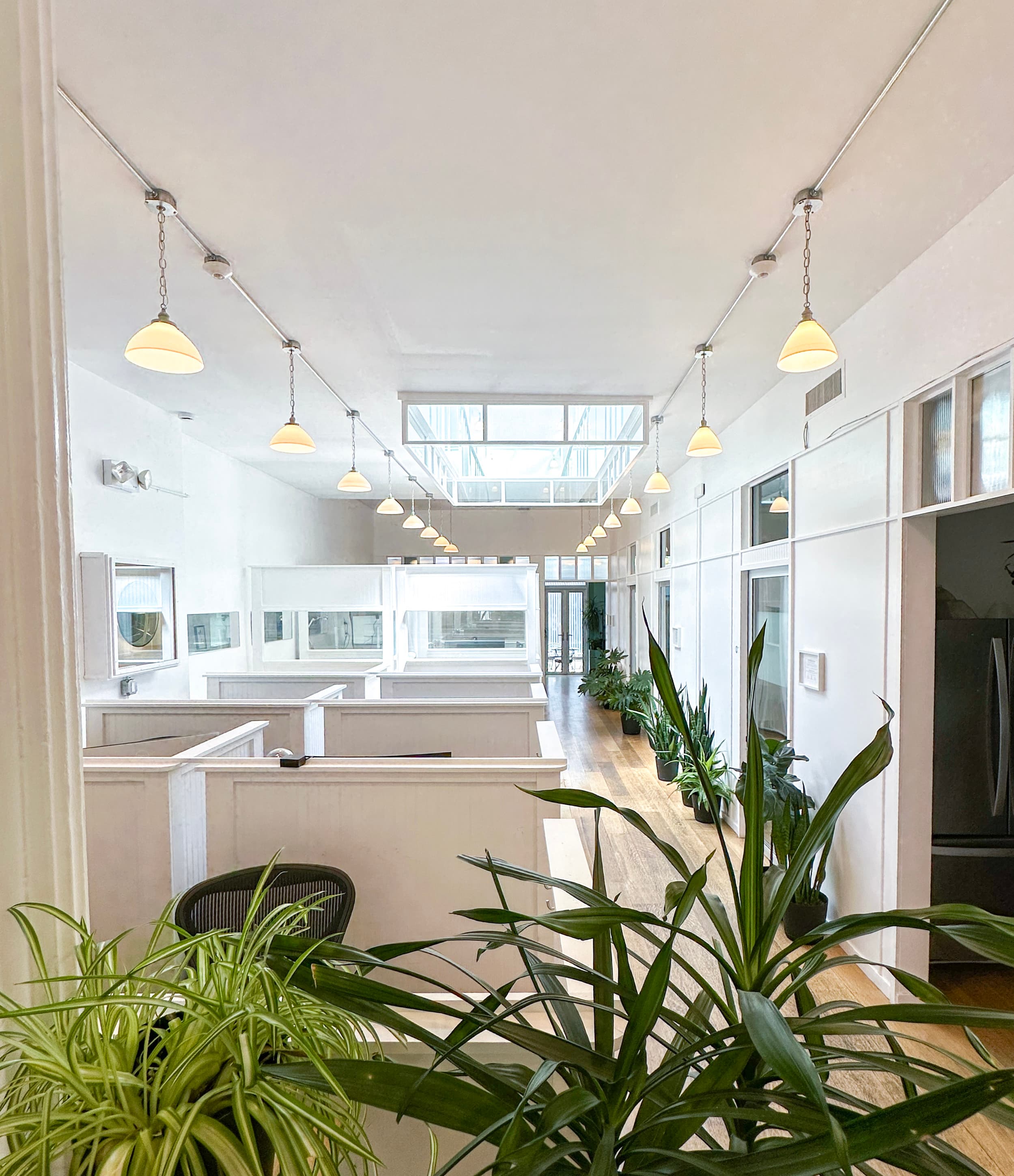 Open plan workspace with personal desks