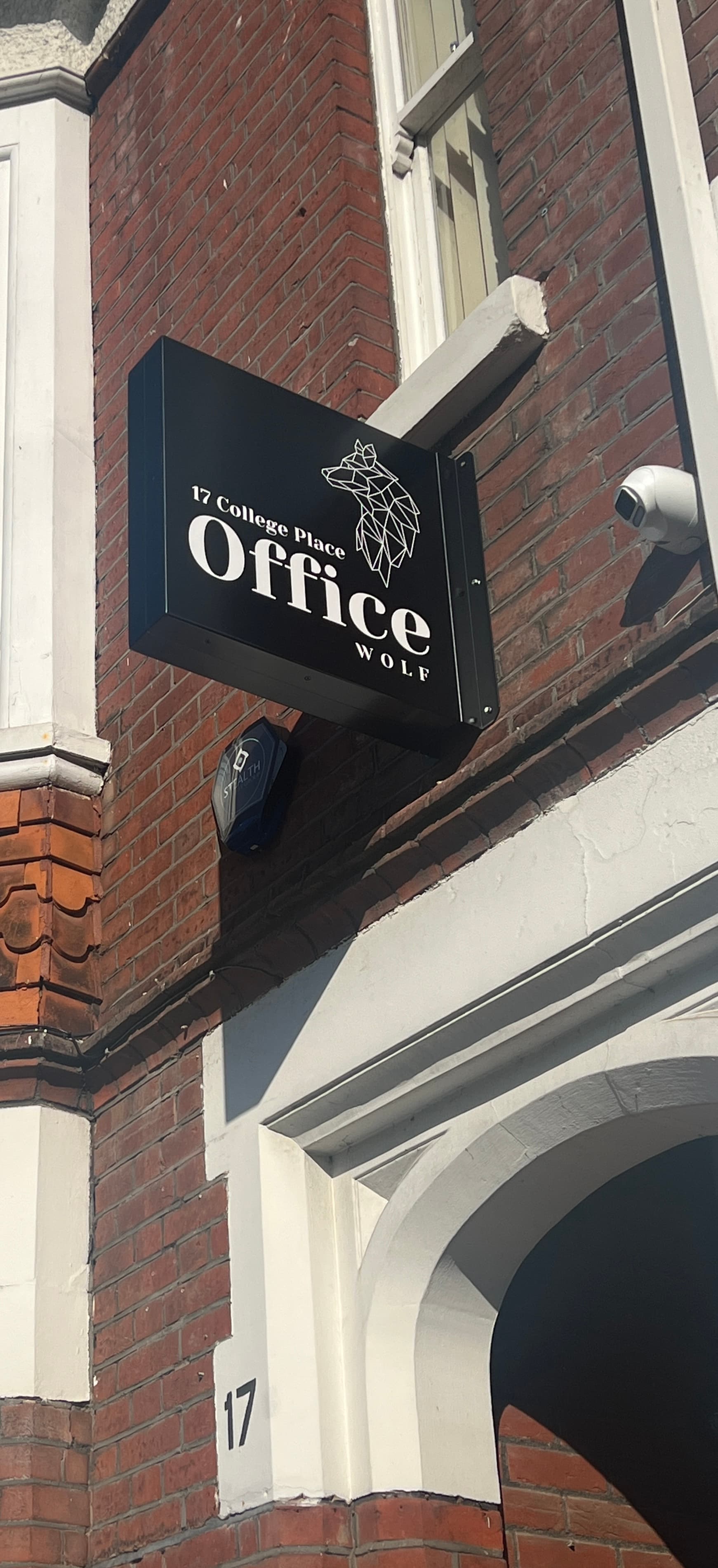 Striking Office Wolf sign on the brick building showcasing bold and premium branding Striking Office Wolf sign on the brick building showcasing bold and premium branding