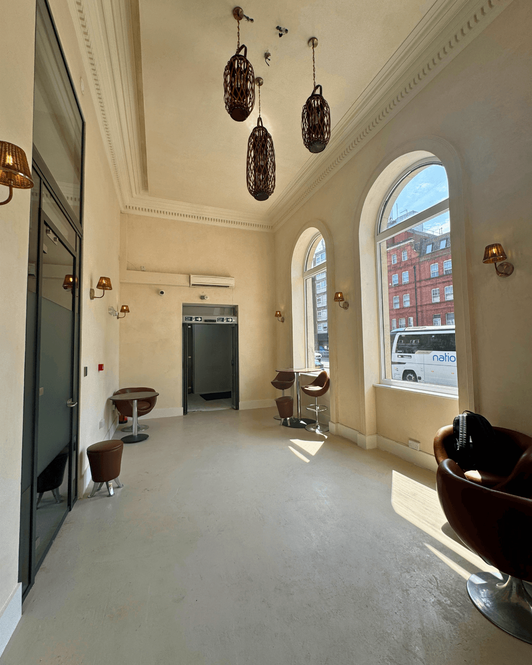 Client lounge with leather seating & natural light. SSV Suites, Finchley Road NW3, North London.