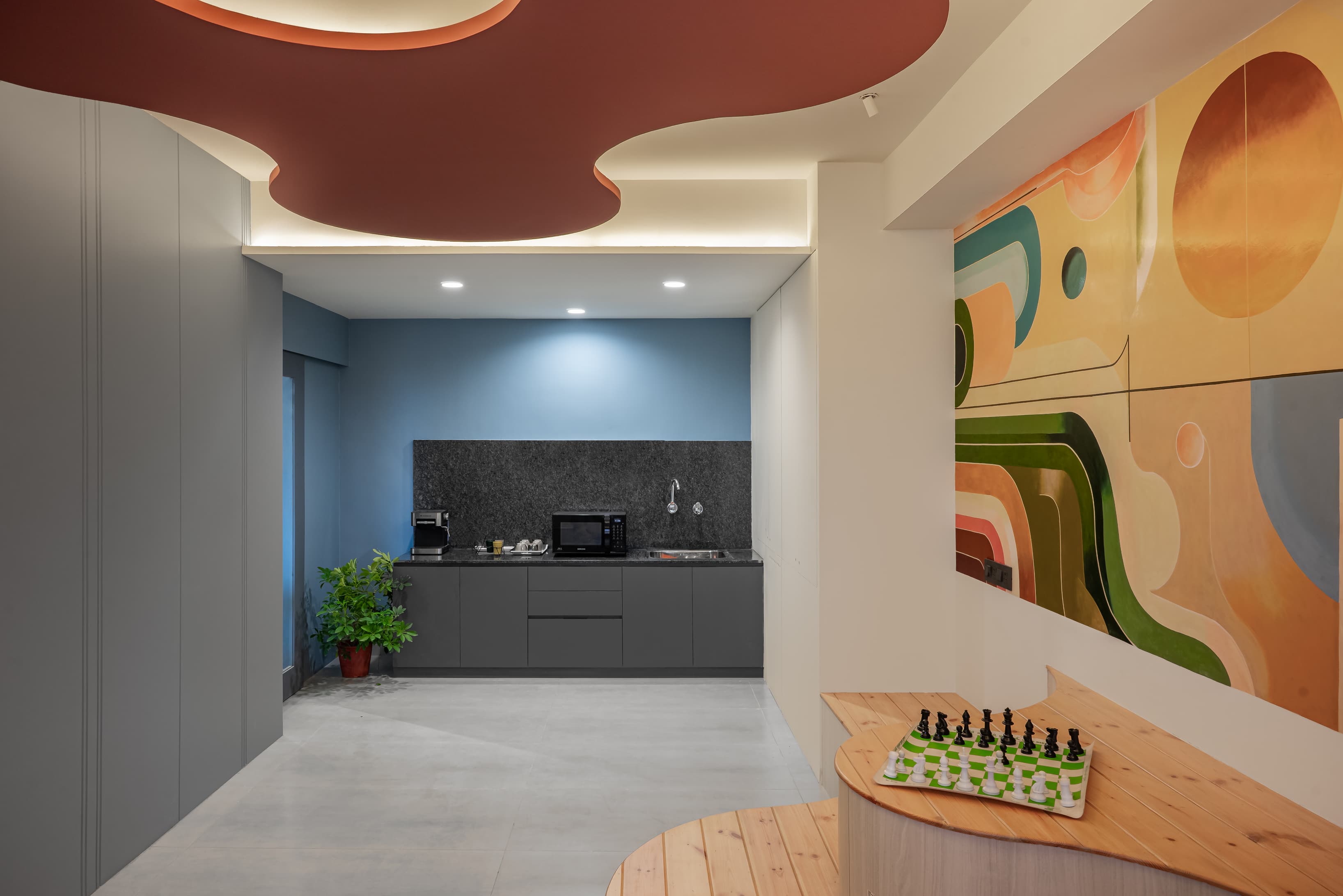 Equipped with modular storage, microwave, and coffee station for seamless work-and-dine functionality.