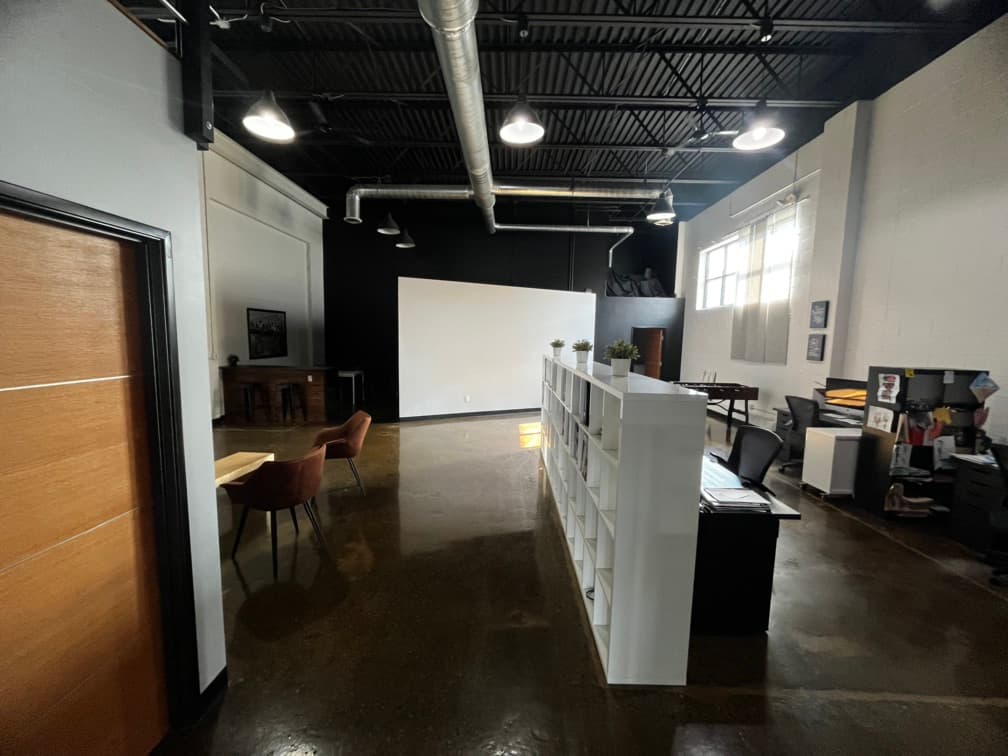 view from end of hallway to back office area. Kitchen back left, bathroom back right. 