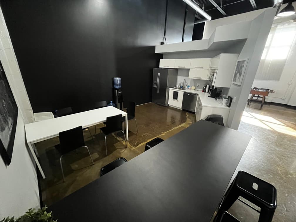 Kitchen area. Dishwasher, microwave, refrigerator, sink. 