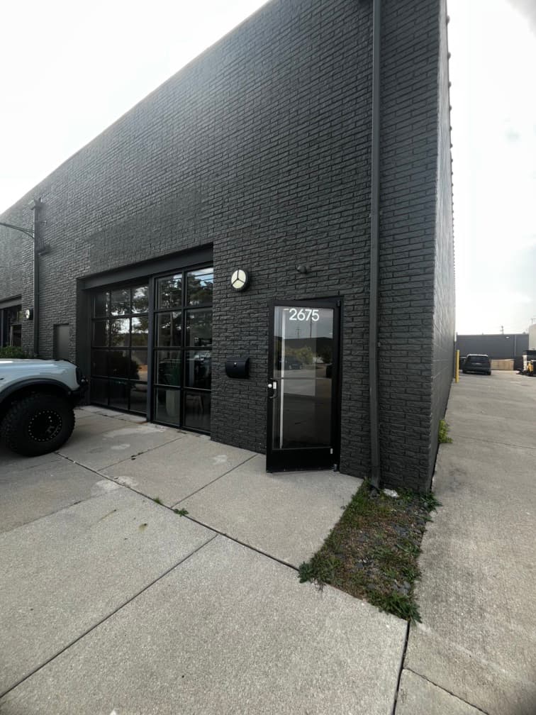 View of outside the office. Garage door does open. 