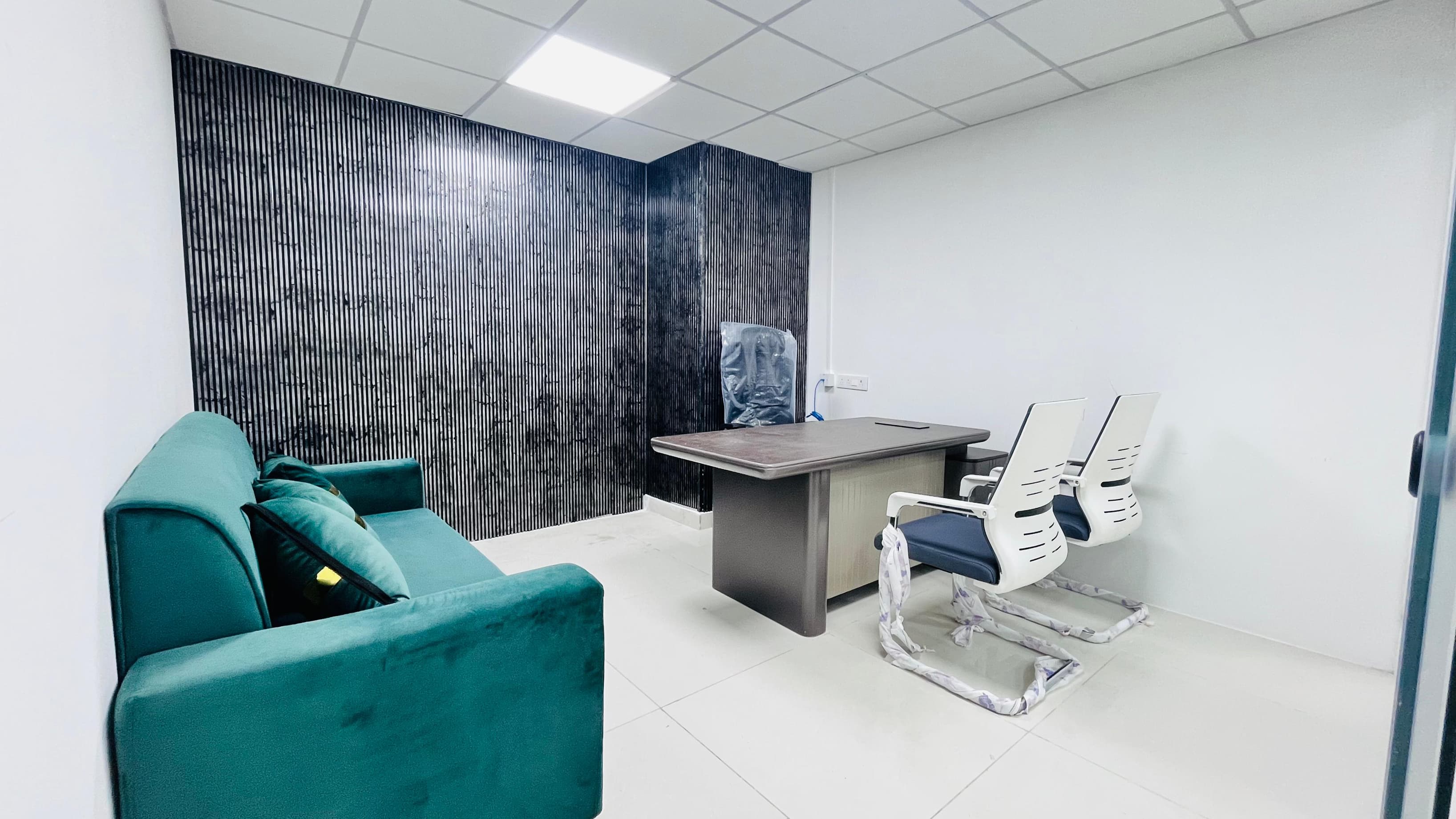 A fully furnished executive cabin designed for senior management or directors, offering privacy, premium interiors, ergonomic