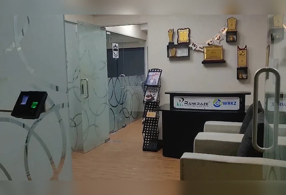 Ecowrkz Coimbatore reception and waiting area, featuring a professional front desk, comfortable visitor seating and a welcomi Ecowrkz Coimbatore reception and waiting area, featuring a professional front desk, comfortable visitor seating and a welcomi