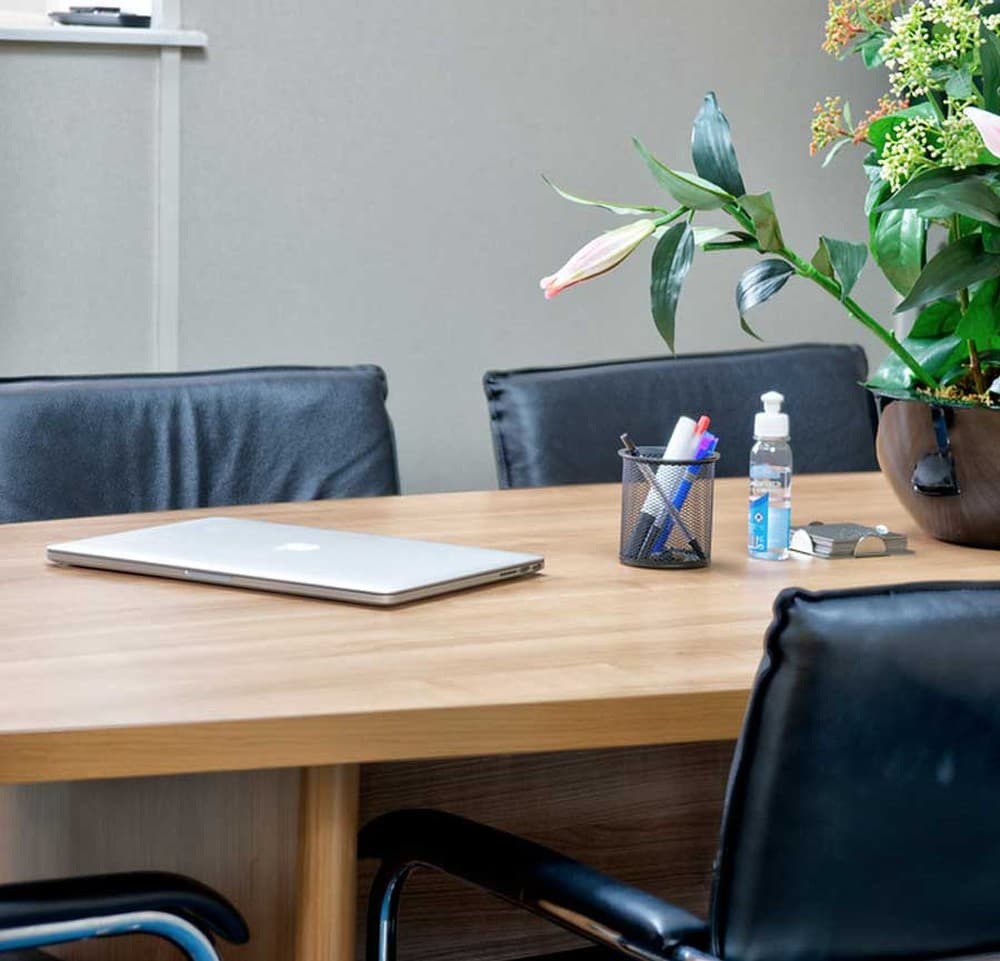 Furnished office — Typical office setup with desk, ergonomic chair, phone, and desk lamp Furnished office — Typical office setup with desk, ergonomic chair, phone, and desk lamp