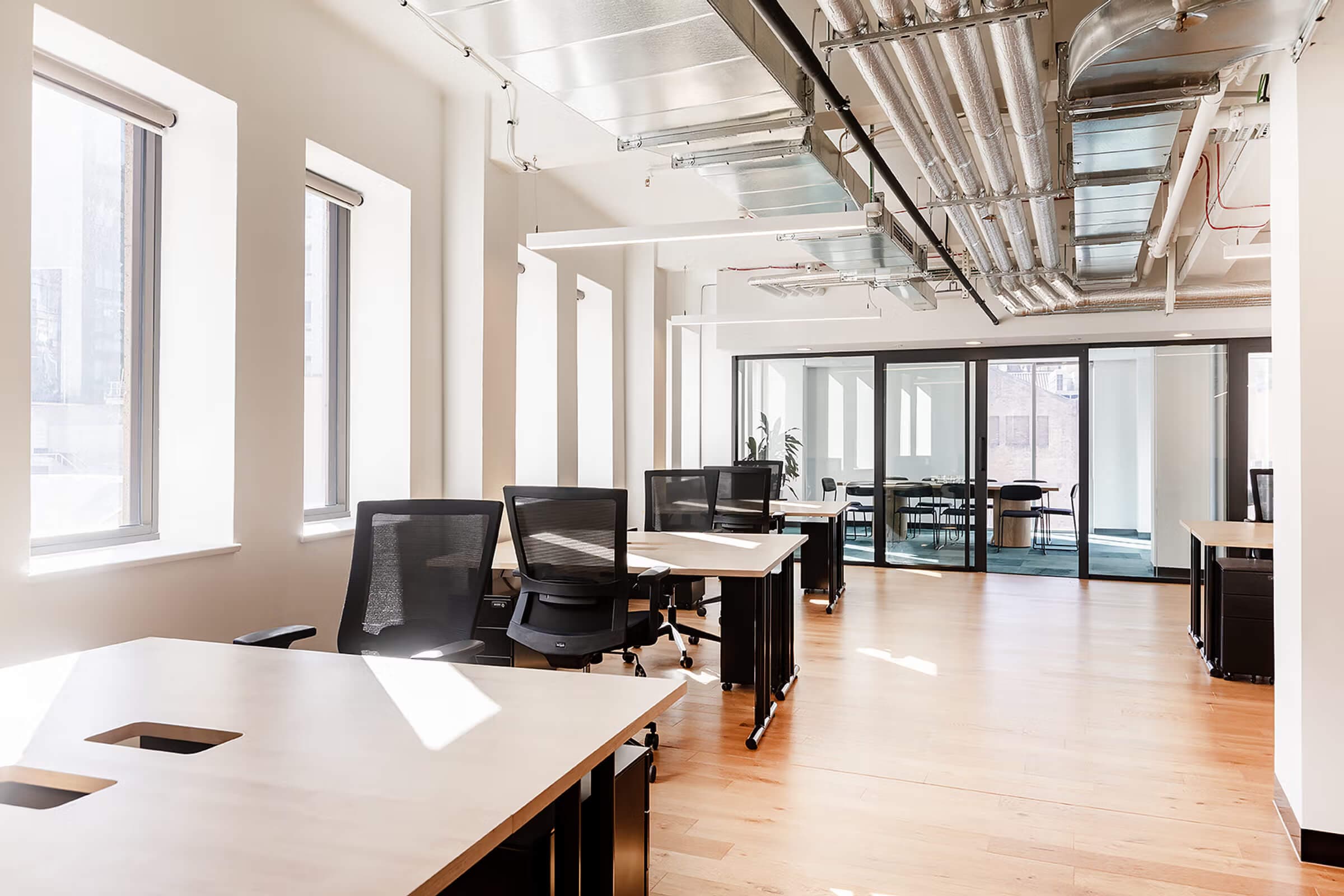 Fully furnished private office space with ergonomic chairs and glass walls. Fully furnished private office space with ergonomic chairs and glass walls.