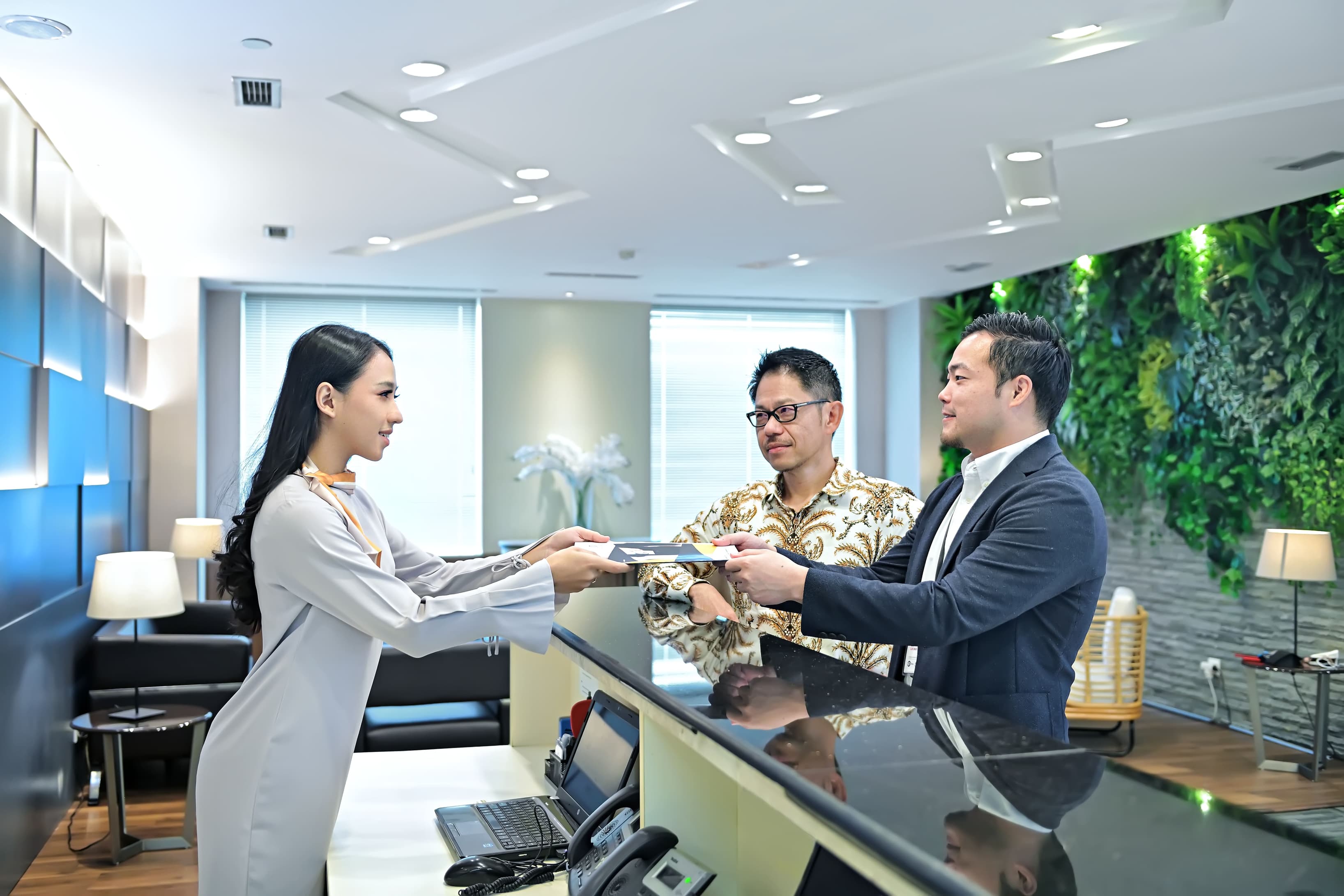 Professional front desk providing assistance to clients and visitors. Professional front desk providing assistance to clients and visitors.