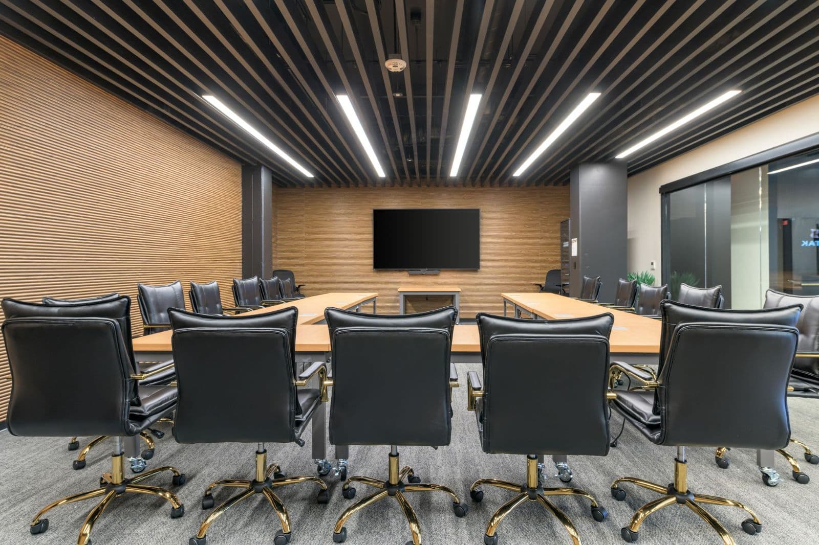 Conference room with long table and display Conference room with long table and display