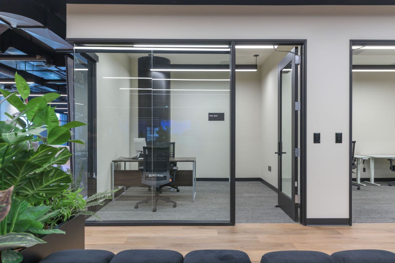 Glass-walled private office Glass-walled private office