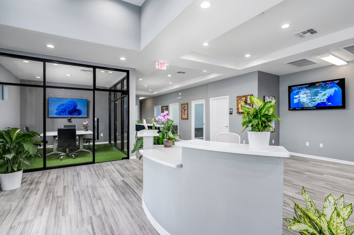 Bright lobby and reception, with glass-walled meeting rooms just off the main area. Bright lobby and reception, with glass-walled meeting rooms just off the main area.