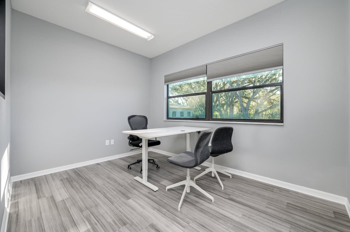 Two-desk private office with natural light and lockable door (representative layout). Two-desk private office with natural light and lockable door (representative layout).