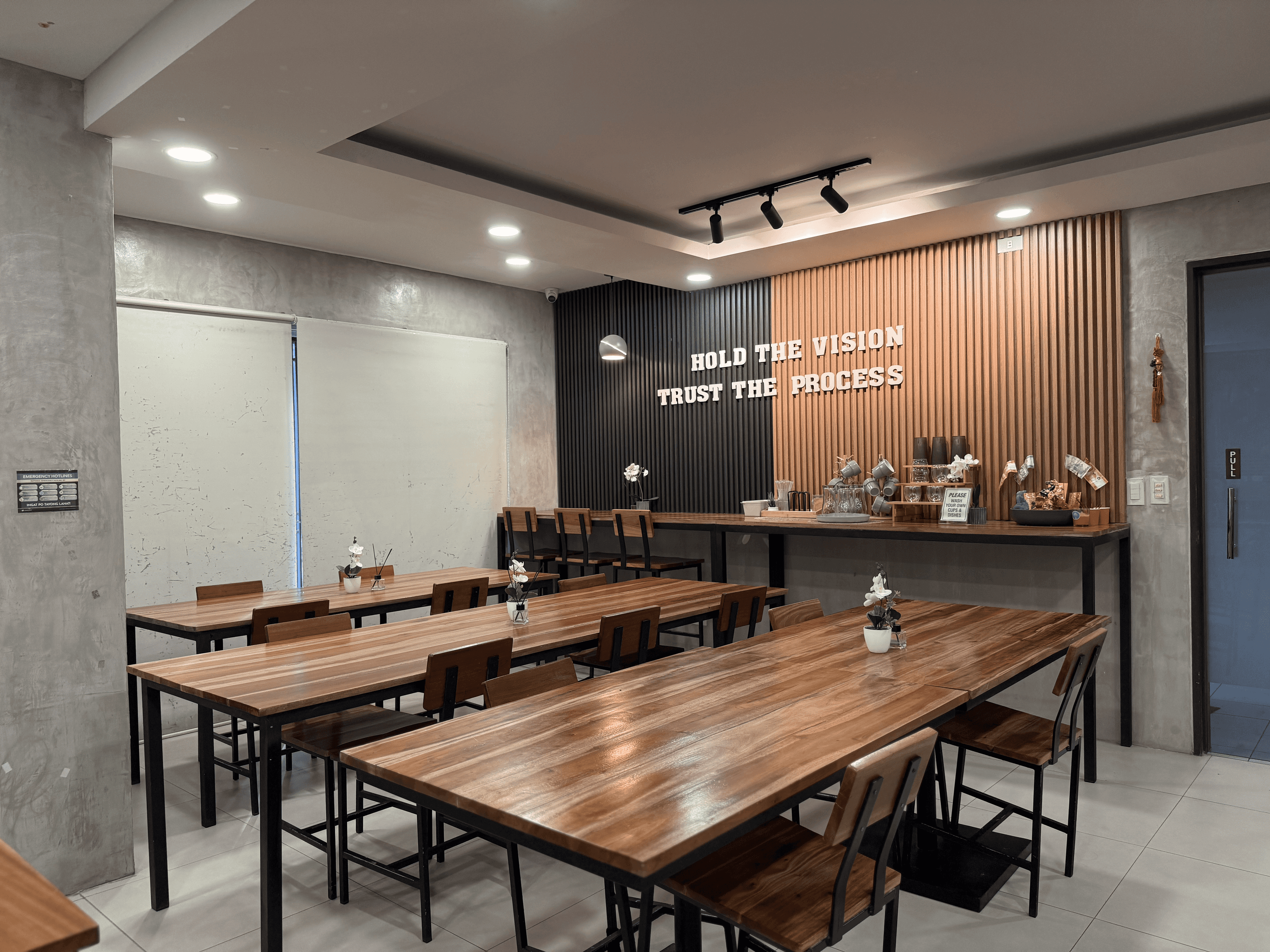 Shared Working Area - A welcoming space for working, studying, and collaborating, with shared tables and bar seating. Shared Working Area - A welcoming space for working, studying, and collaborating, with shared tables and bar seating.