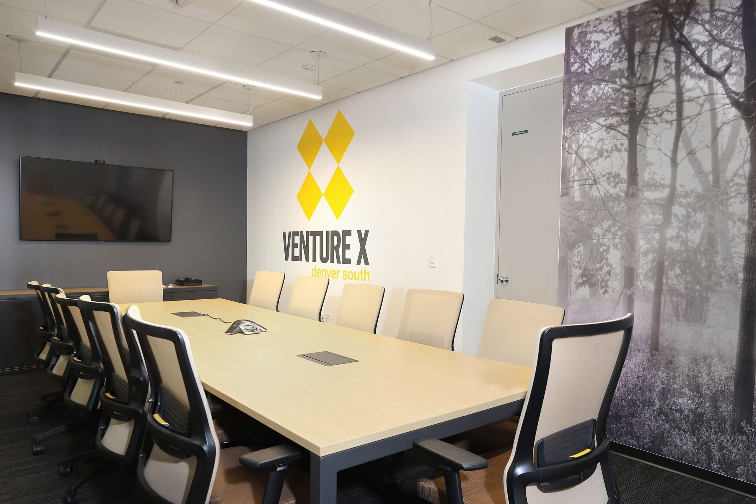 Large conference room at Venture X Denver South with boardroom-style seating, AV display, and acoustic privacy for meetings. Large conference room at Venture X Denver South with boardroom-style seating, AV display, and acoustic privacy for meetings.