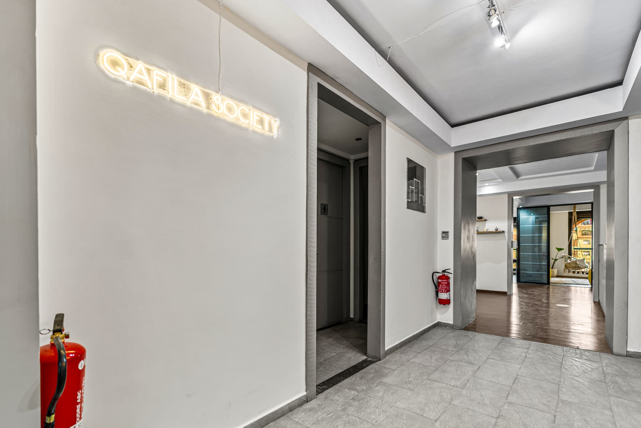 Office entrance and interior hallway at Qafila Society in Gueliz, Marrakech, showcasing the professional workspace and modern Office entrance and interior hallway at Qafila Society in Gueliz, Marrakech, showcasing the professional workspace and modern