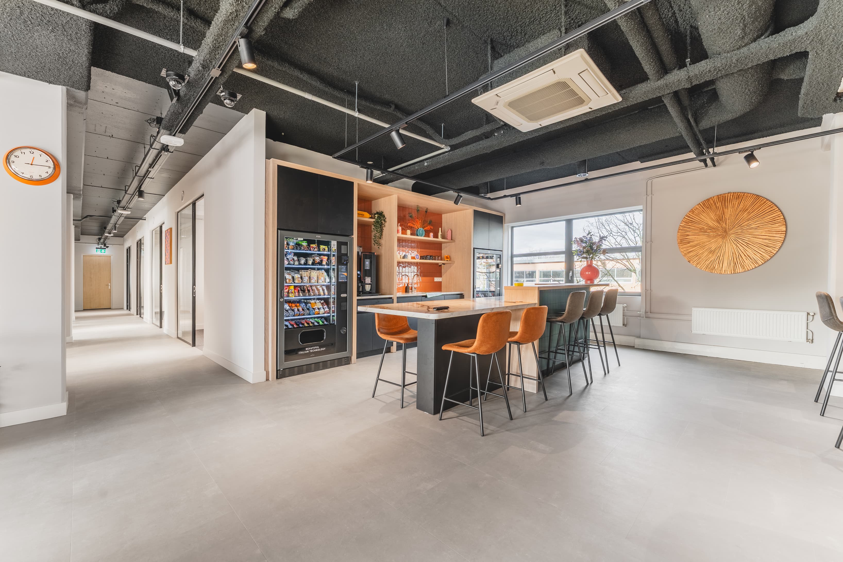 Stylish pronominal area with vending machines and kitchen island. Stylish pronominal area with vending machines and kitchen island.