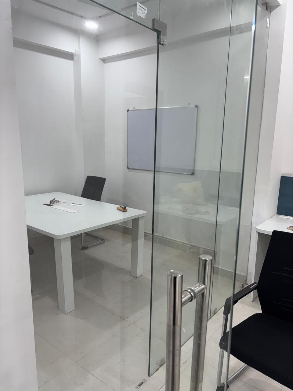 Private glass meeting room with elegant seating, ideal for meetings, discussions, and client interactions. Private glass meeting room with elegant seating, ideal for meetings, discussions, and client interactions.