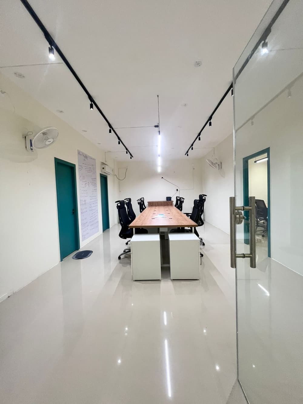 Well-lit office space with clean and minimal interiors Well-lit office space with clean and minimal interiors