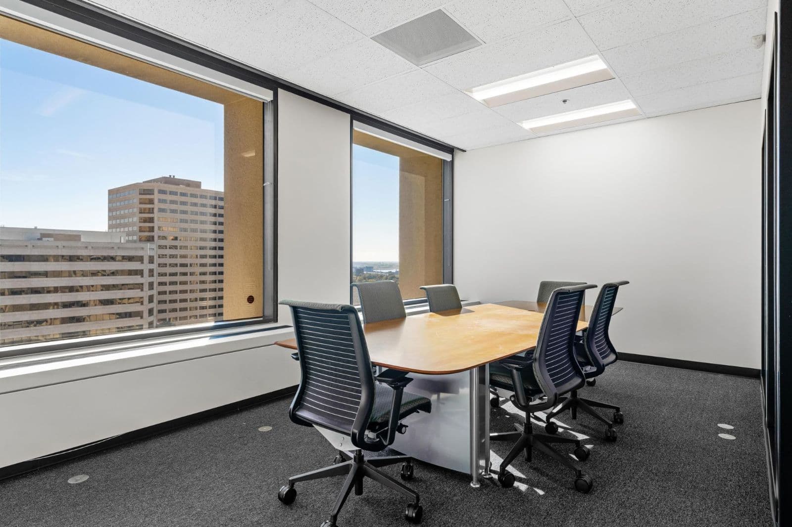 Meeting room with floor-to-ceiling windows Meeting room with floor-to-ceiling windows