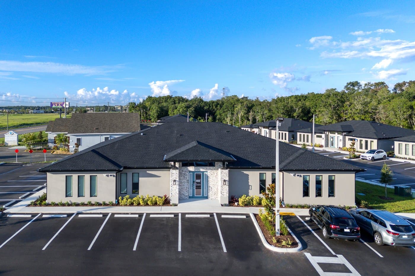 Aerial view of the building and its free surface parking lot in Cypress Bend Professional Park. Aerial view of the building and its free surface parking lot in Cypress Bend Professional Park.