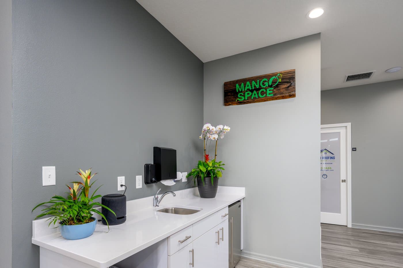 Coffee bar with sink and counter space for a quick refill between calls. Coffee bar with sink and counter space for a quick refill between calls.