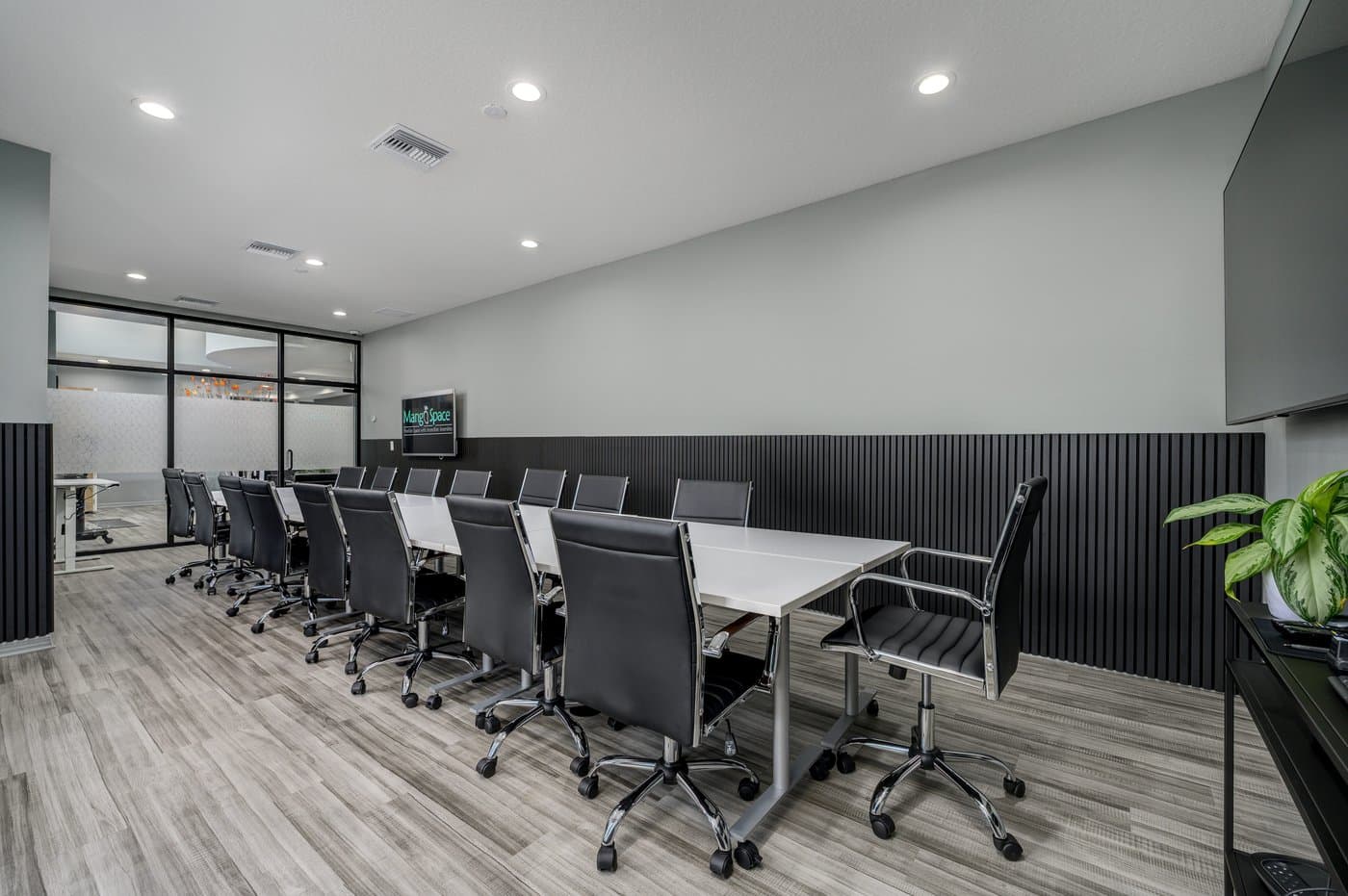 Orange Mango conference room: our largest, seating up to 30, with a large display and video conferencing. Orange Mango conference room: our largest, seating up to 30, with a large display and video conferencing.
