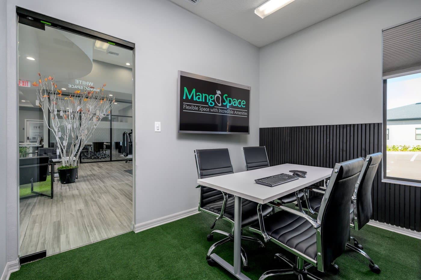 White Mango meeting room: seats 6, with a wall display for calls and presentations. White Mango meeting room: seats 6, with a wall display for calls and presentations.