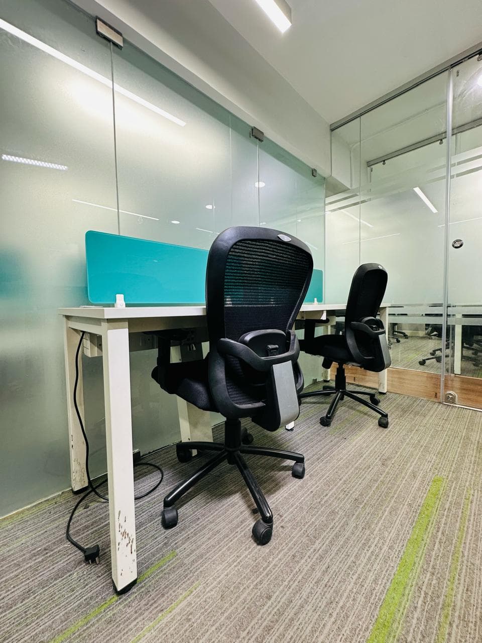 Flexible hot desk workspace with ergonomic seating and modern amenities. Flexible hot desk workspace with ergonomic seating and modern amenities.