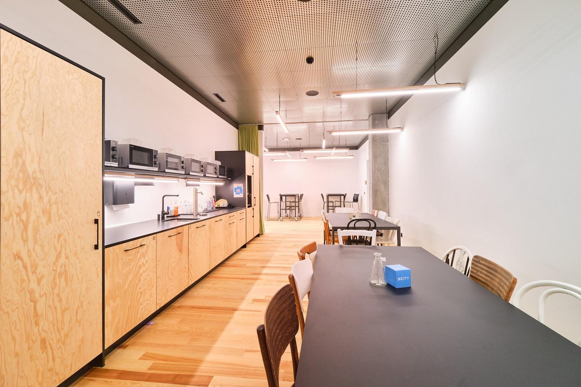 A shared kitchen offering complimentary coffee, tea, and fresh filtered water (still and sparkling). A shared kitchen offering complimentary coffee, tea, and fresh filtered water (still and sparkling).
