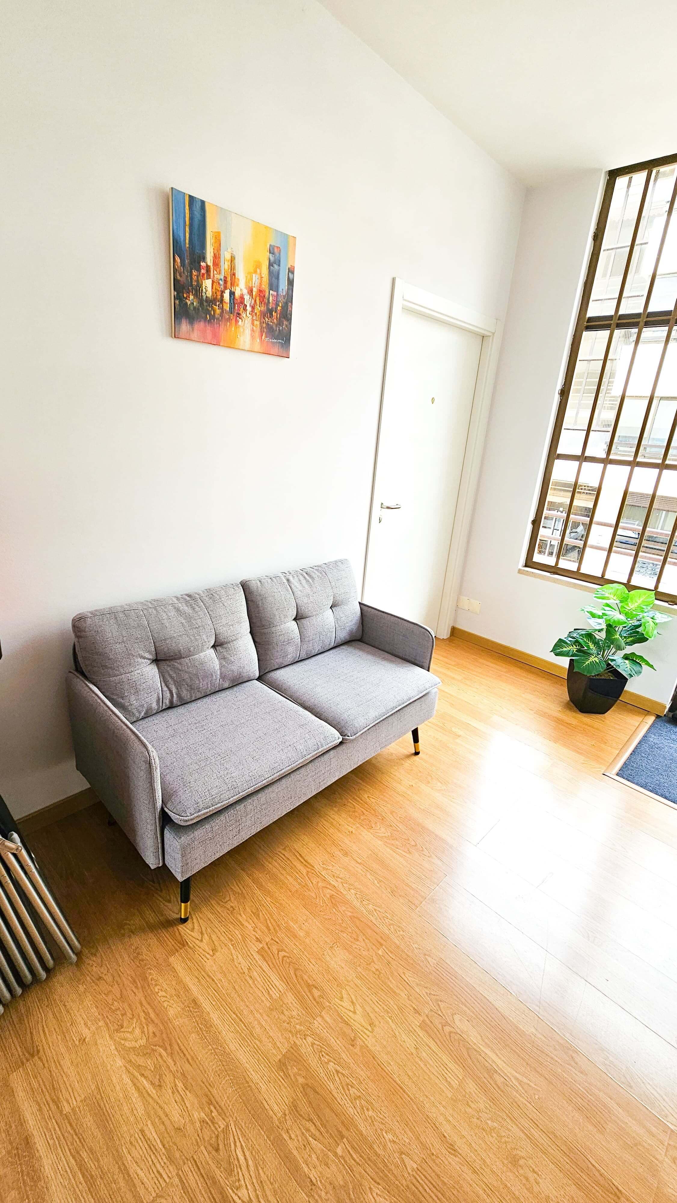 Comfortable lounge area with sofa and natural light, providing a relaxed space for breaks, informal meetings, or waiting time Comfortable lounge area with sofa and natural light, providing a relaxed space for breaks, informal meetings, or waiting time