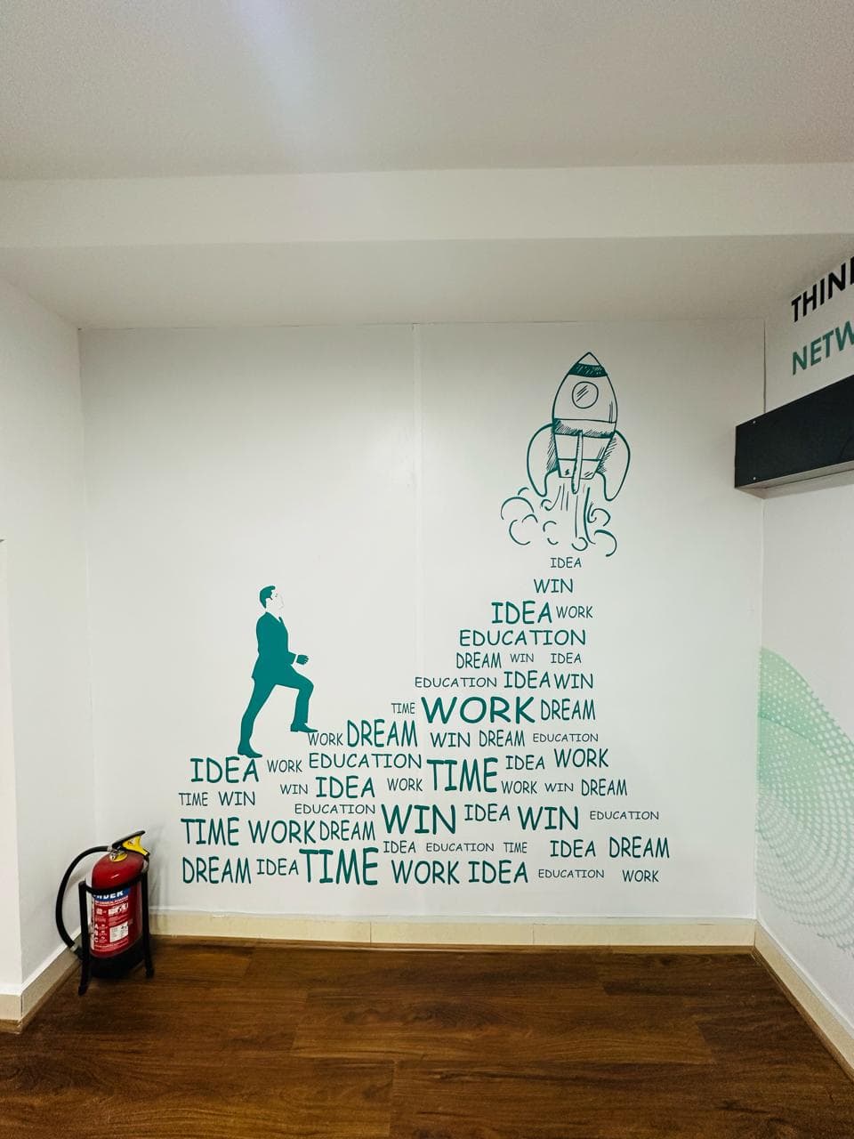 Interior corridor at Ecowrkz Guindy featuring creative motivational wall graphics that add character to the workspace and cre Interior corridor at Ecowrkz Guindy featuring creative motivational wall graphics that add character to the workspace and cre
