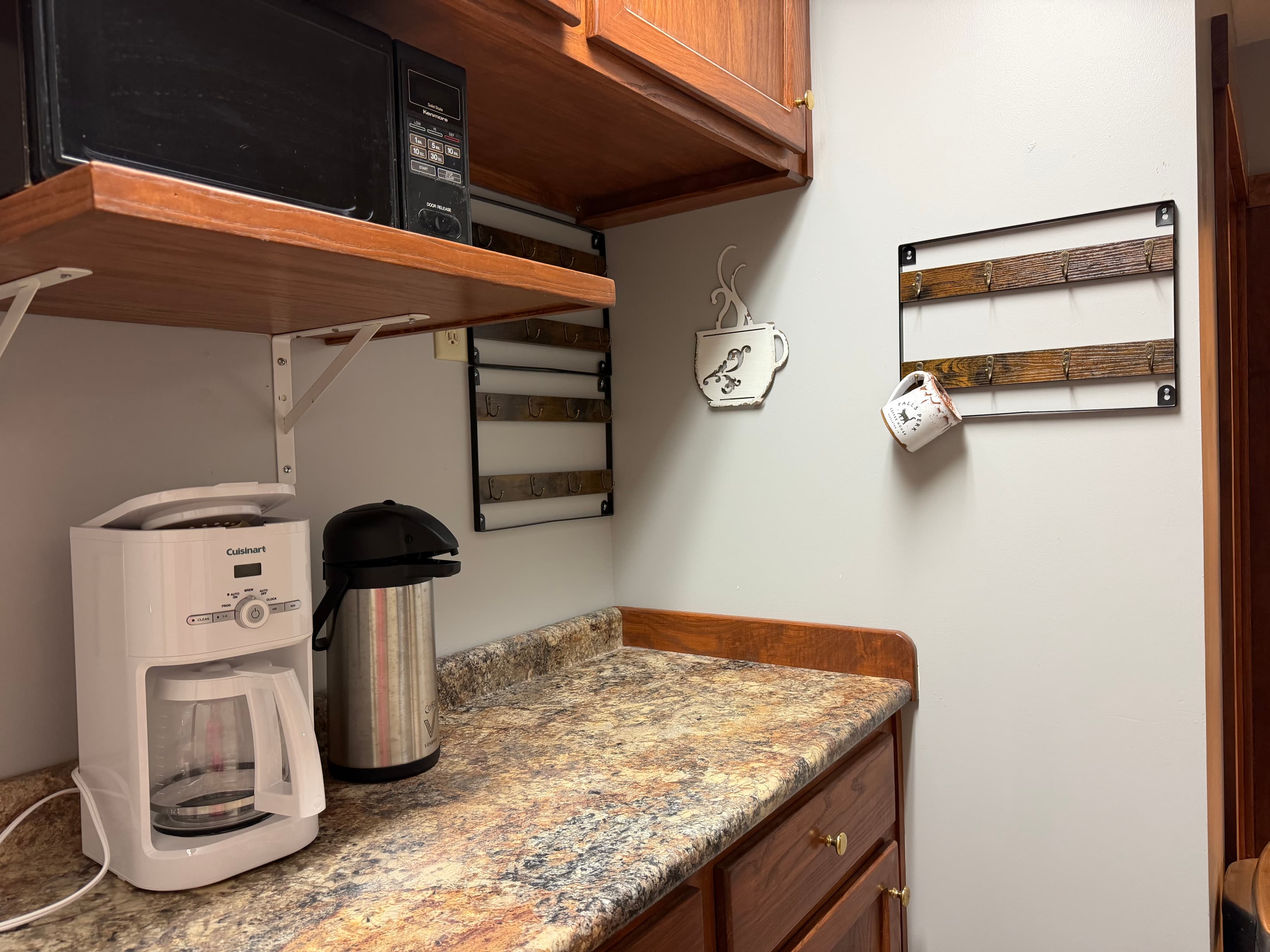 Kitchenette area with Coffee, tea, snacks, and a fridge. Kitchenette area with Coffee, tea, snacks, and a fridge.