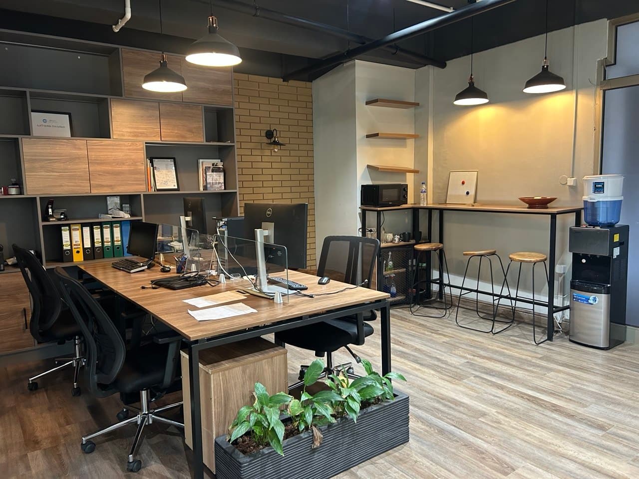 Coworking workspace with shared desks, coffee & refreshment station, microwave access and drinking water. Coworking workspace with shared desks, coffee & refreshment station, microwave access and drinking water.