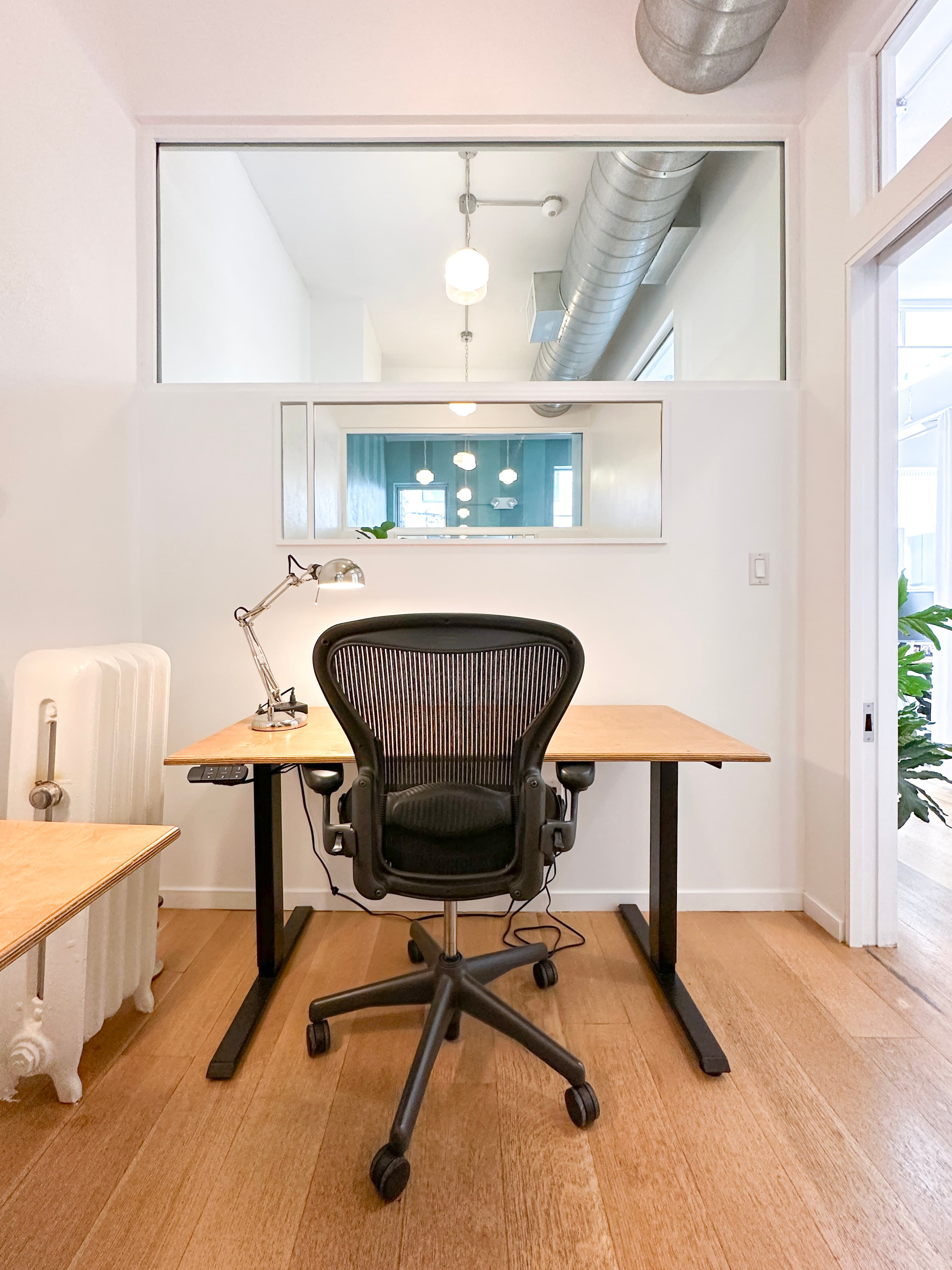 Natural light through beautiful transoms windows in the private offices Natural light through beautiful transoms windows in the private offices