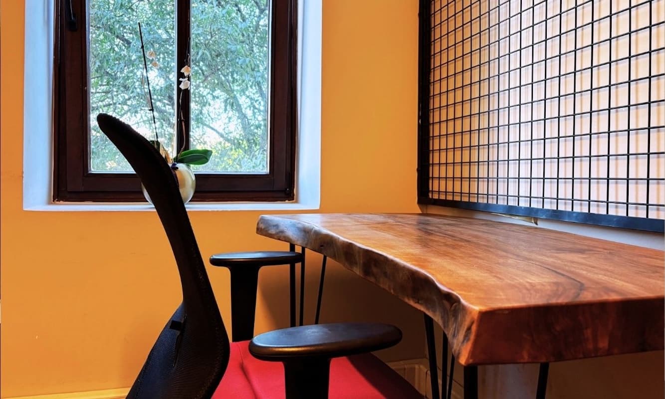 A stylish office environment with walnut wood desktops and tasteful furniture. A stylish office environment with walnut wood desktops and tasteful furniture.